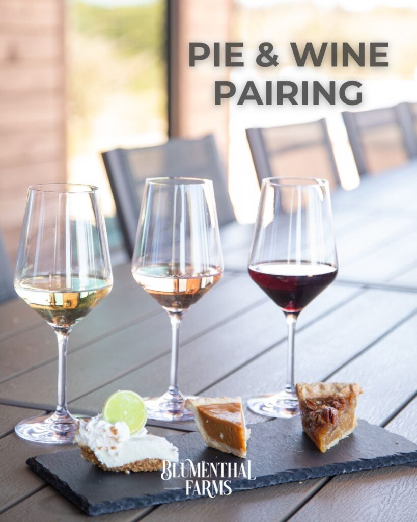 Three slices of mini pie (key lime, pumpkin and pecan) paired with three glasses of wine on a table, served as a pairing.